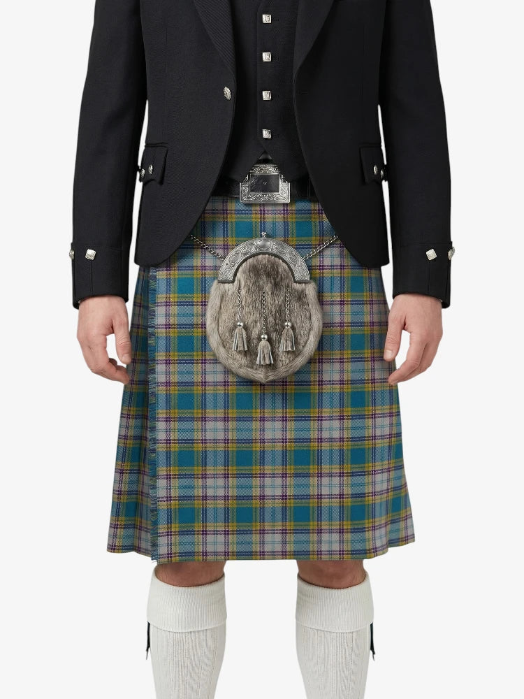 Person wearing a Scottish kilt with a tartan pattern on a white background