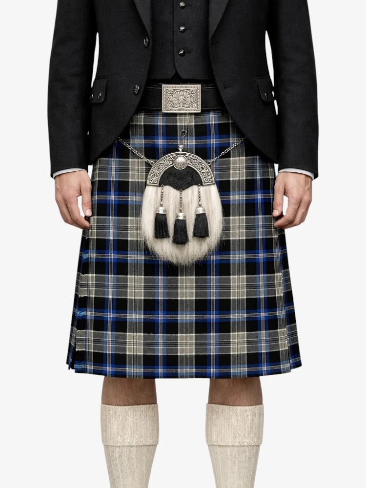 Person wearing a traditional Scottish kilt with a plaid pattern on a white background