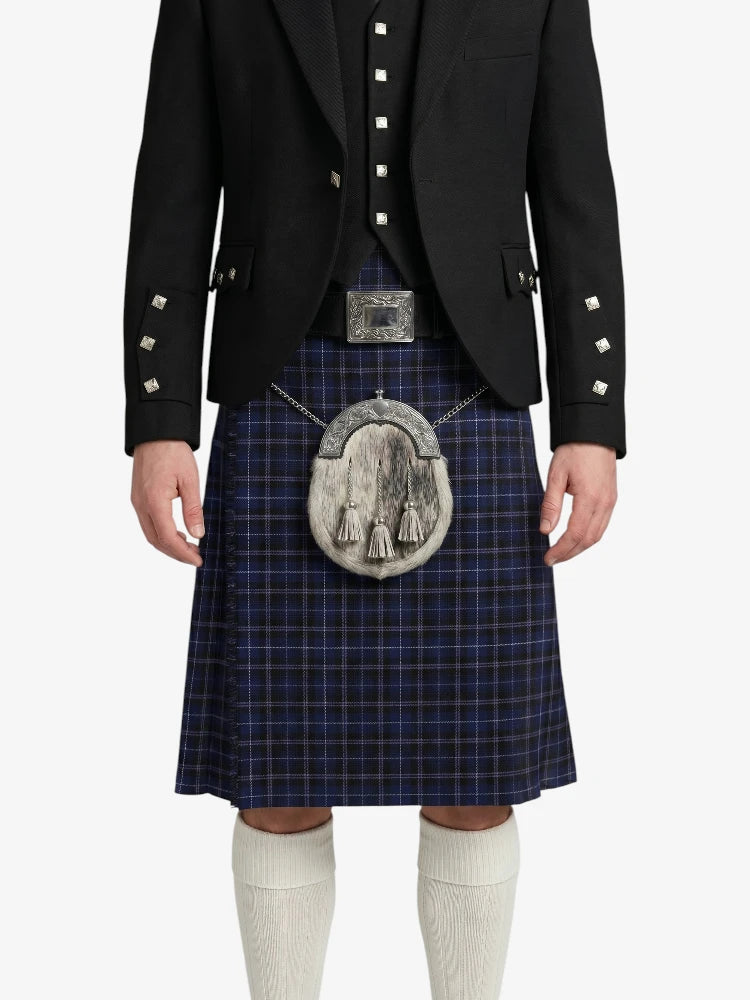 Person wearing a traditional Scottish kilt with a jacket on a white background