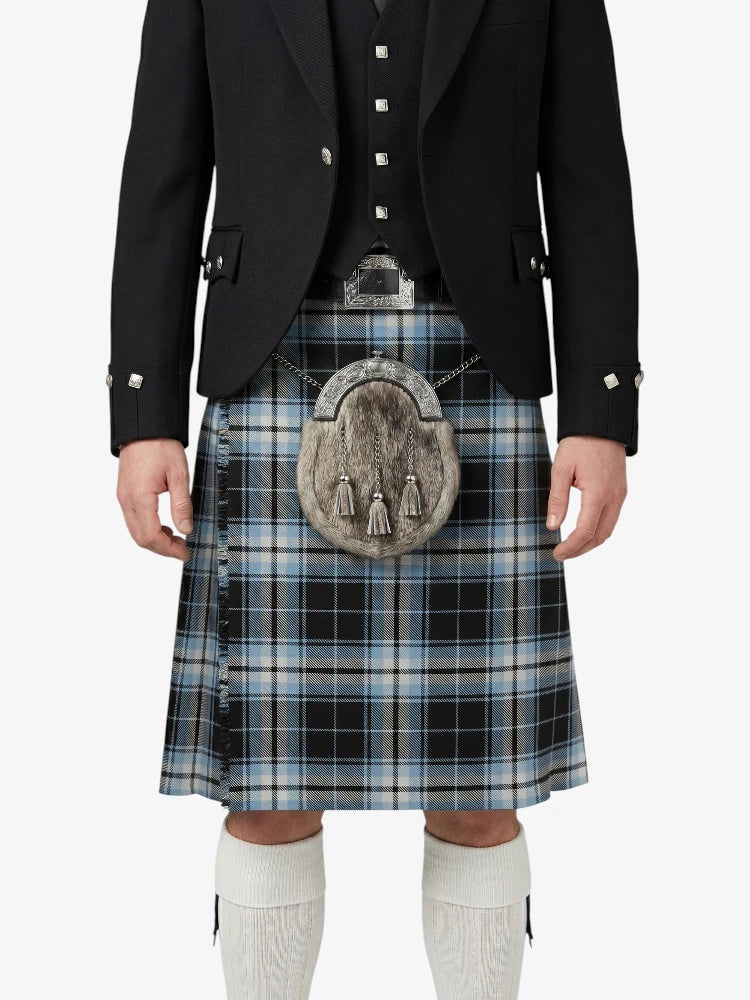 Person wearing a traditional Scottish kilt with a jacket on a white background