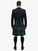 Person wearing a black prince charlie jacket and gordon tartan plaid kilt on a white background