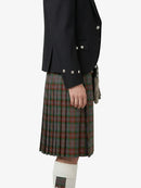 Person wearing a dark jacket and plaid kilt on a white background