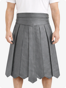 Gray pleated skirt worn by a person on a white background
