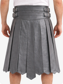 Gray pleated skirt worn by a person on a white background