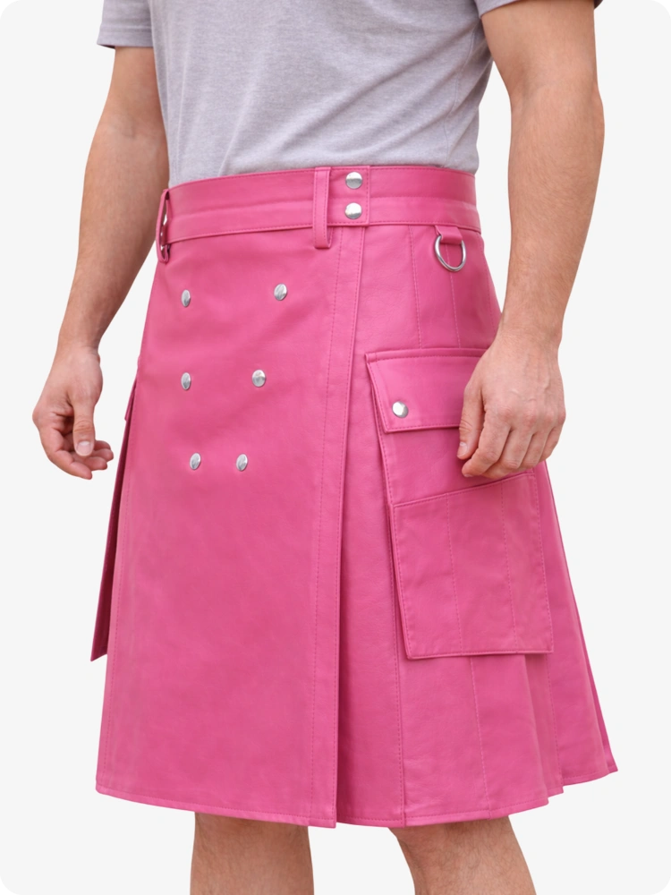 Person wearing a pink kilt with silver buttons on a white background