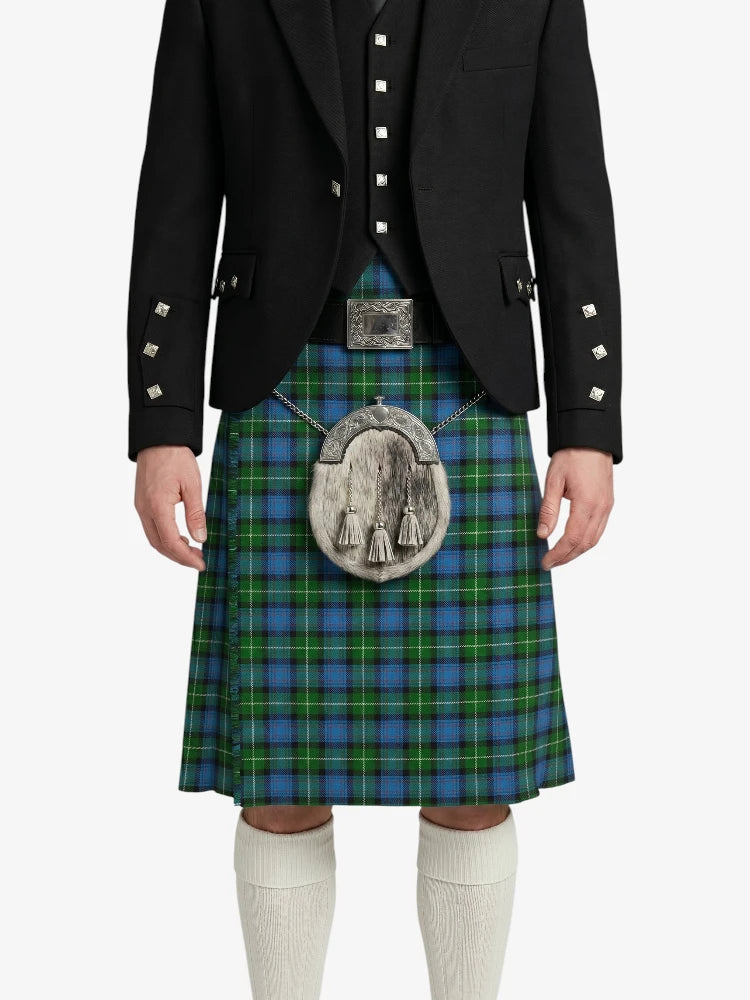 Person wearing a traditional Scottish kilt with a jacket on a white background