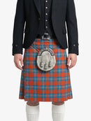 Person wearing a black jacket and red plaid kilt with a silver sporran on a white background