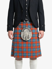 Person wearing a black jacket and red plaid kilt with a silver sporran on a white background