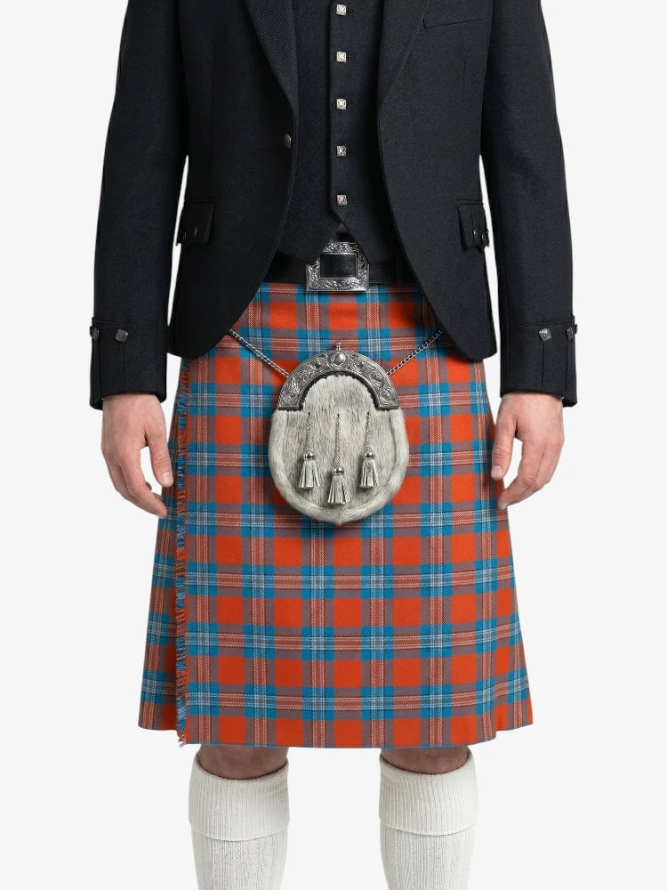 Person wearing a black jacket and red plaid kilt with a silver sporran on a white background