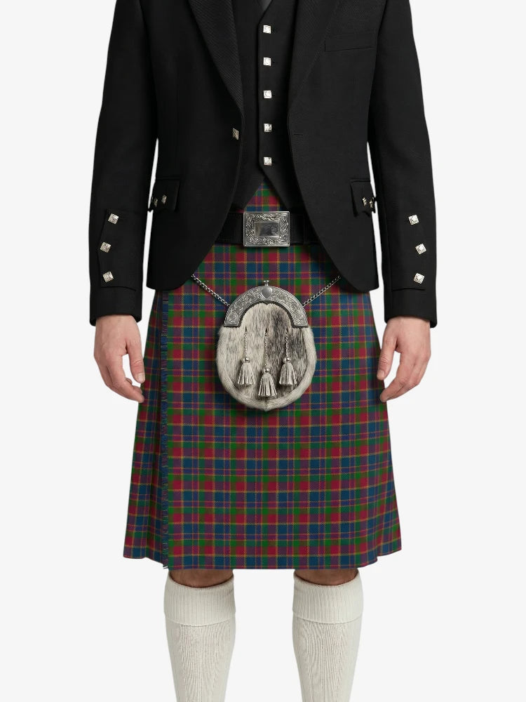 Person wearing a traditional Scottish kilt with a jacket on a white background