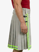 Gray pleated skirt with green accents worn by a person on a white background