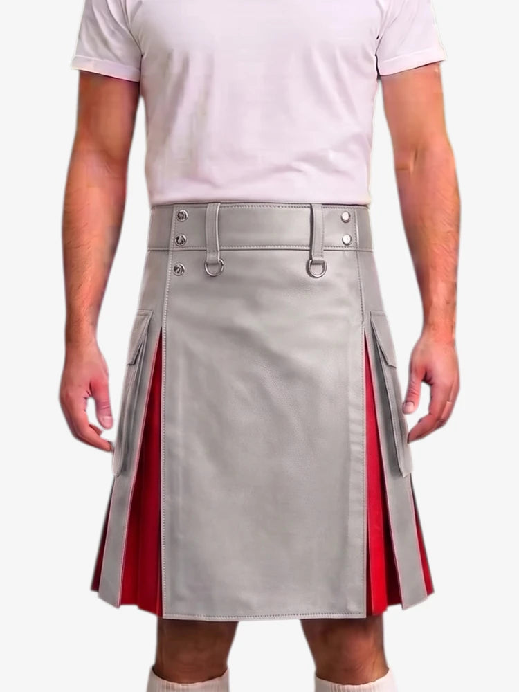 A person wearing a light gray pleated kilt with red side panels and silver buckle details, paired with a pale pink t-shirt against a plain light background.