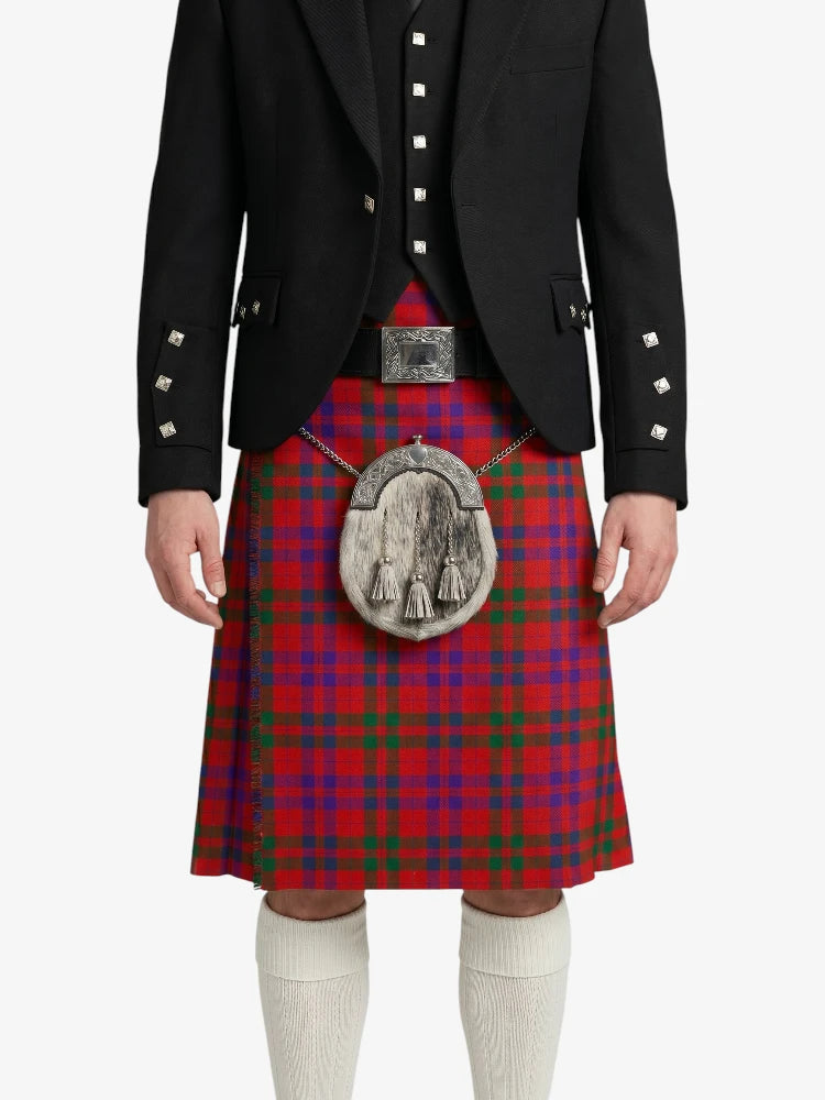Person wearing a red tartan kilt with a black jacket on a white background