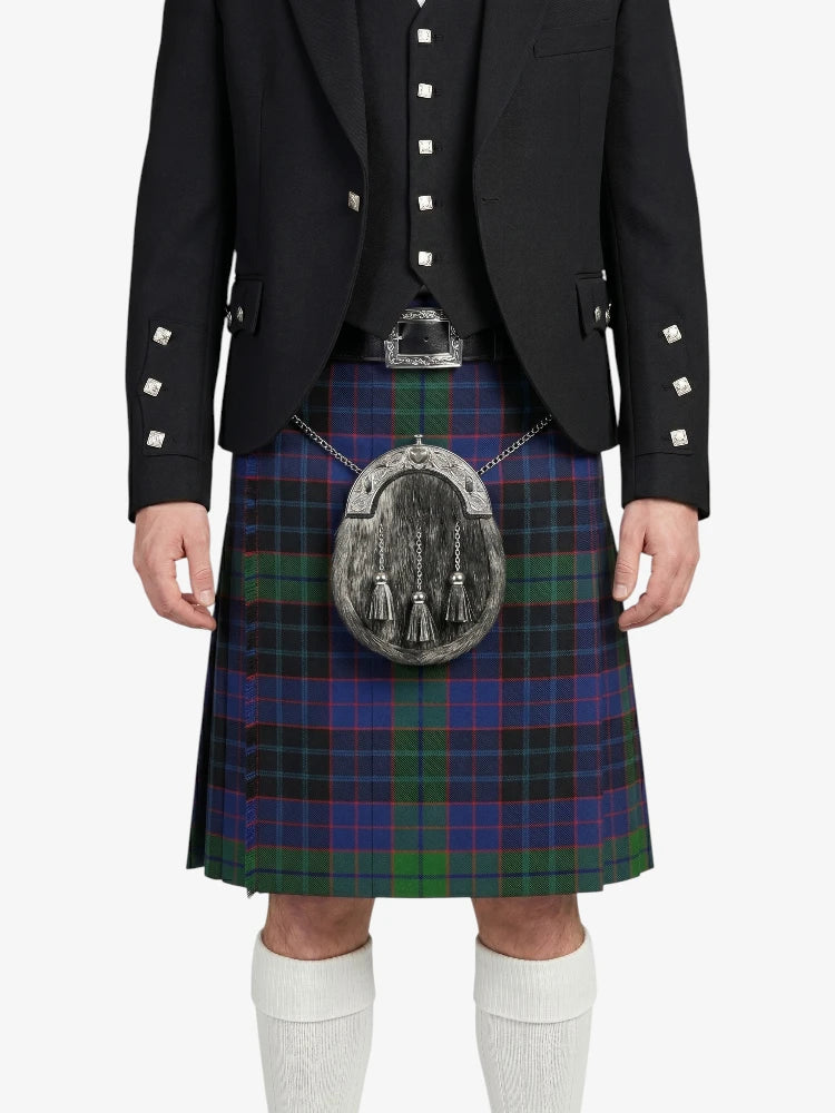 Person wearing a Scottish kilt with a tartan pattern on a white background