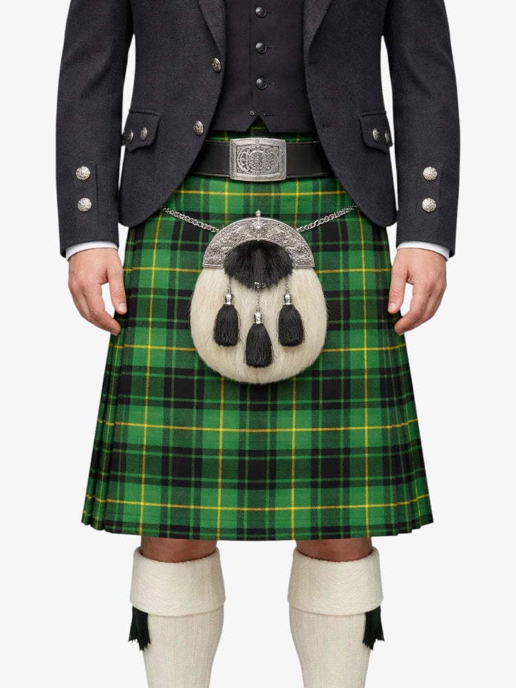 Person wearing a traditional Scottish kilt with a green plaid pattern on a white background