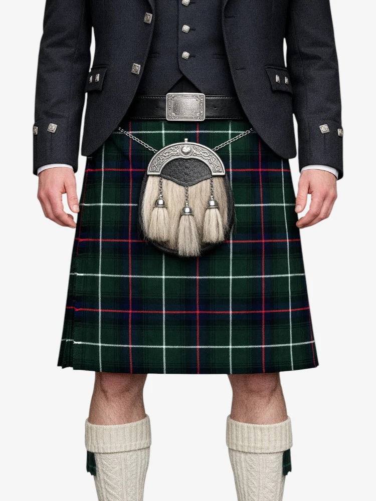Person wearing a traditional Scottish kilt with a tartan pattern on a white background
