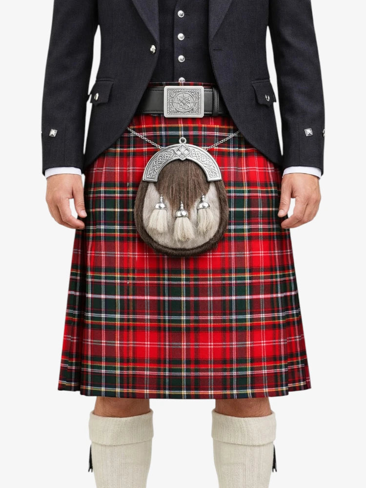 Person wearing a red tartan kilt with a black jacket and white shoes on a white background
