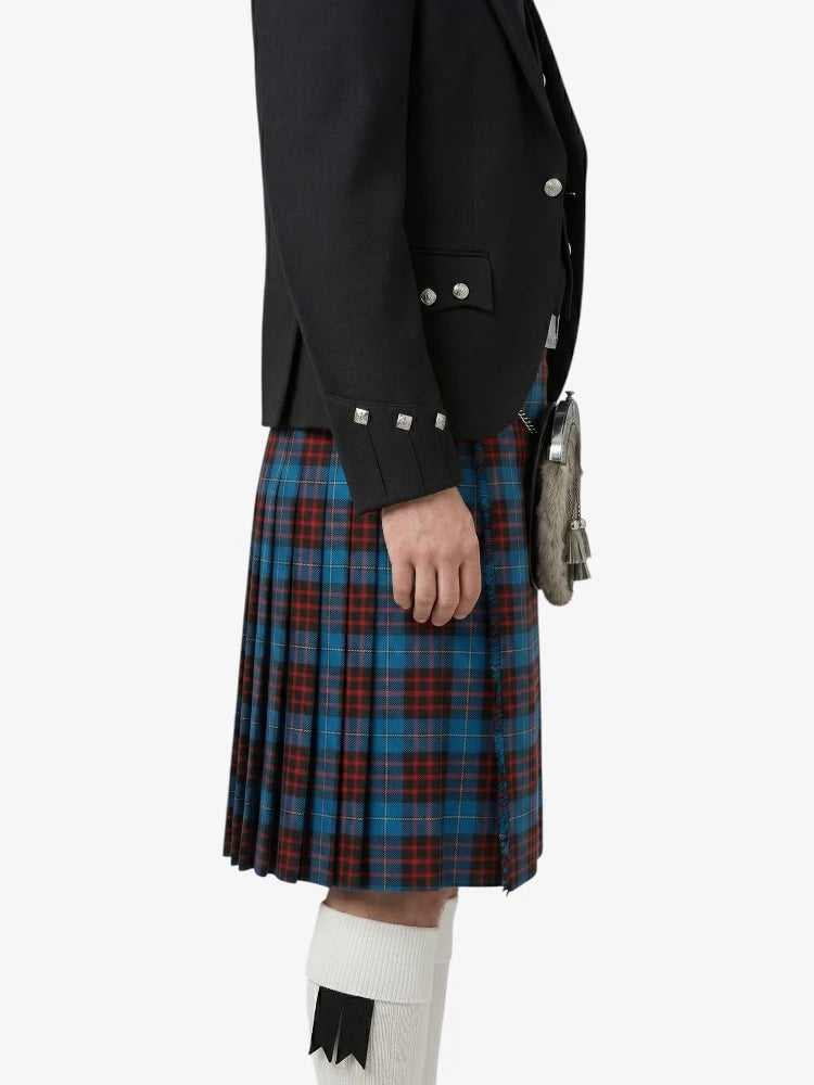 Person wearing a black jacket and blue plaid kilt on a white background