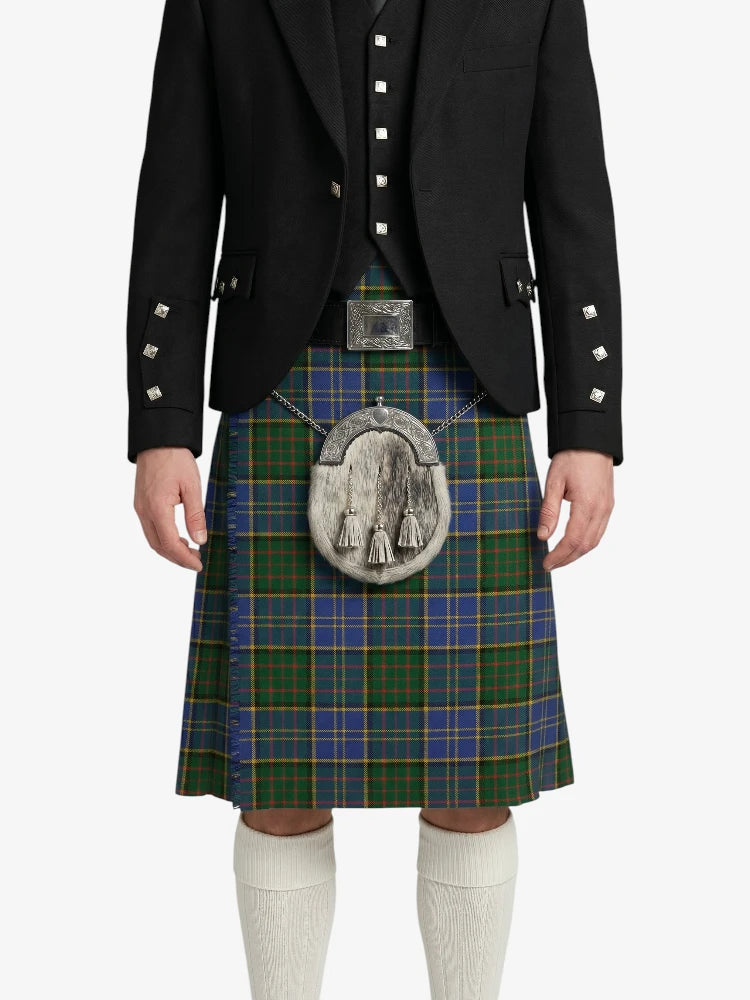 Person wearing a traditional Scottish kilt with a jacket on a white background