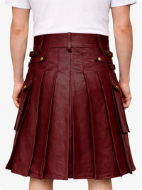 Maroon pleated skirt with gold buttons worn by a person on a white background