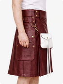 Maroon leather kilt with gold buttons and a white bag on a white background