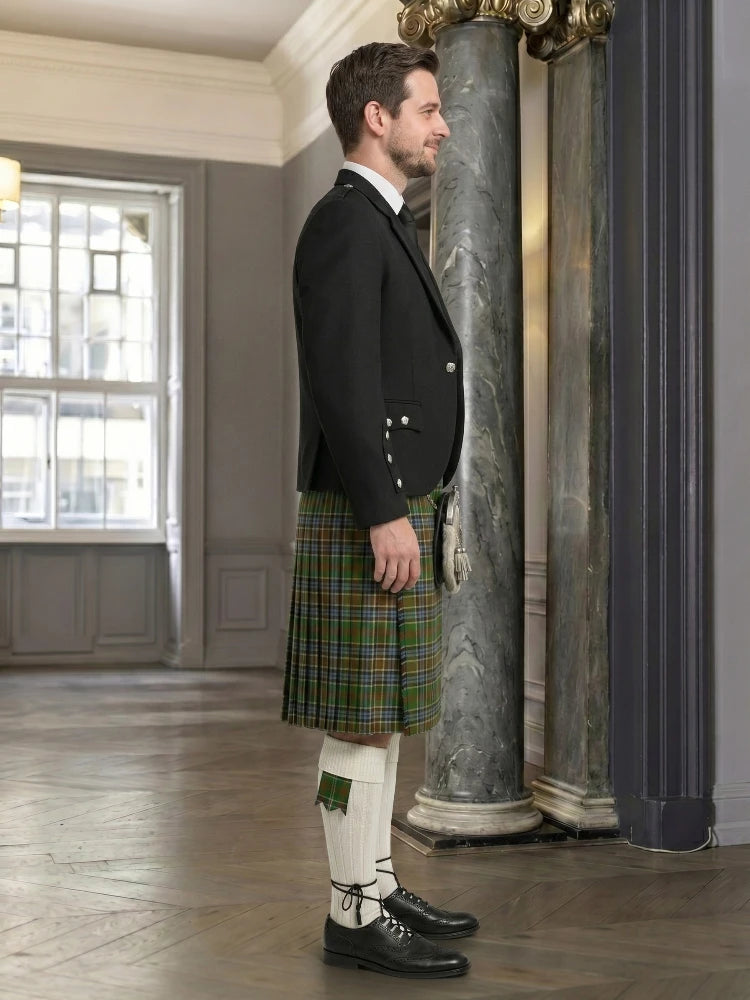 Man wearing a traditional Scottish kilt in an elegant interior setting