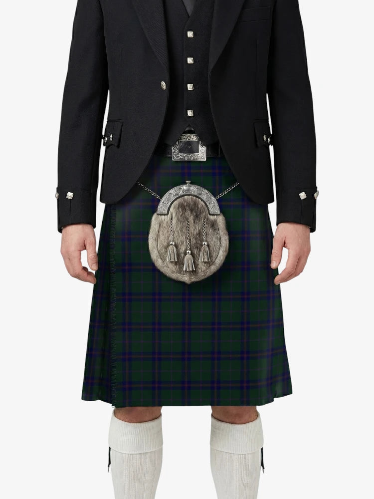 Person wearing a traditional Scottish kilt with a dark jacket on a white background