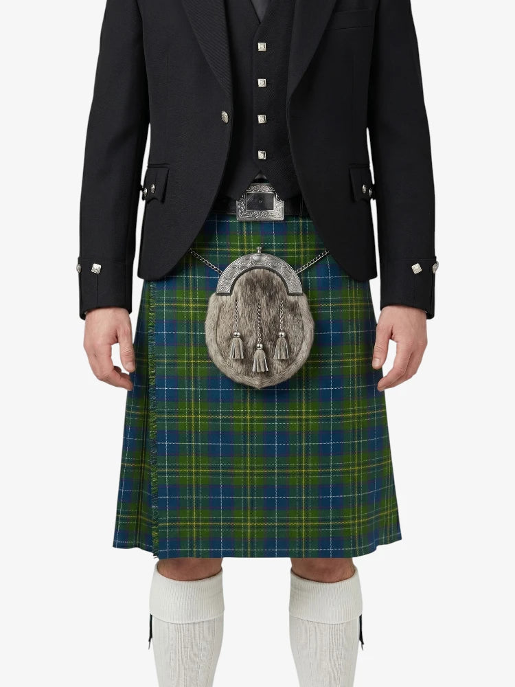 Person wearing a traditional Scottish kilt with a sporran on a white background