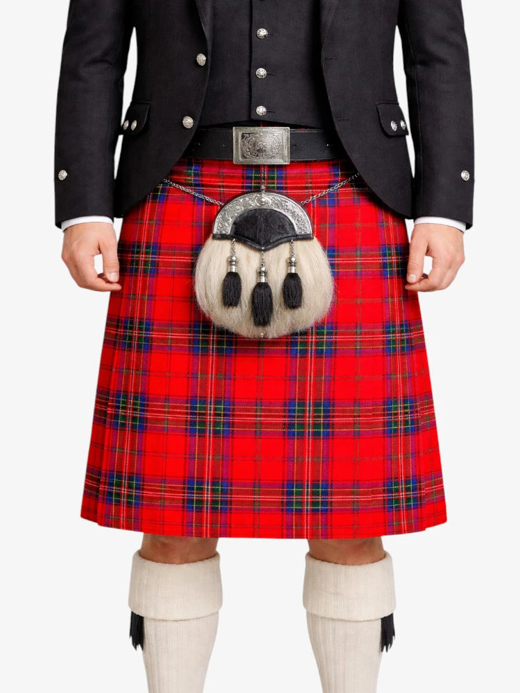 Person wearing a red tartan kilt with a black jacket on a white background