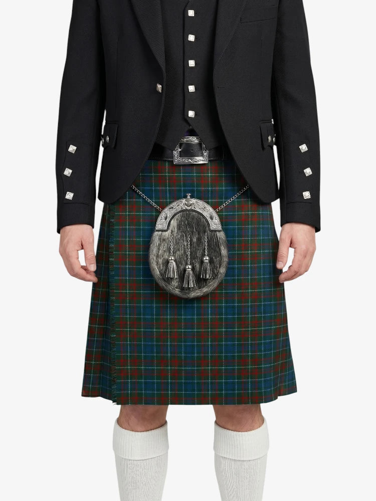 Person wearing a black jacket and tartan kilt with a sporran on a white background