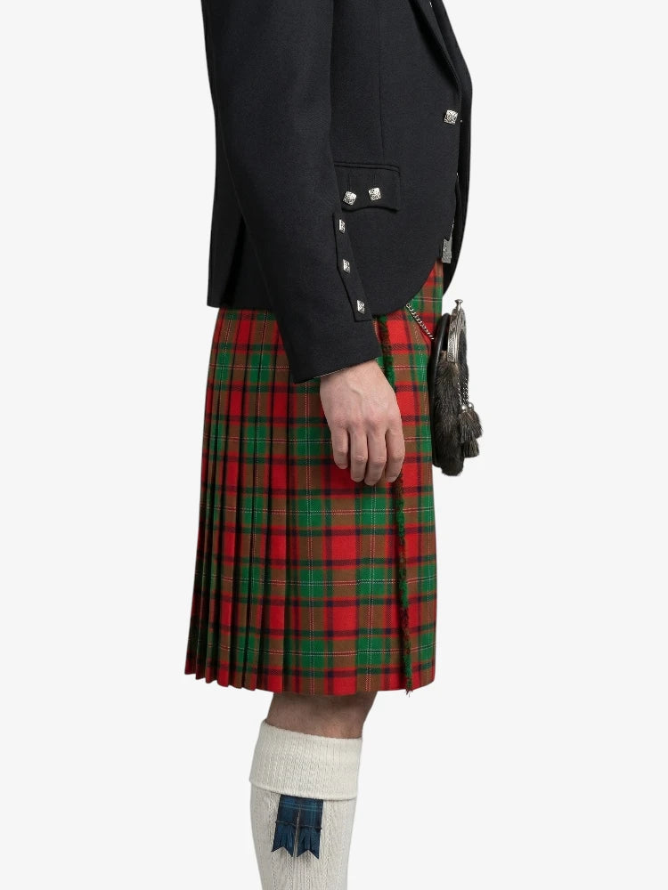 Person wearing a black jacket and red plaid kilt on a white background