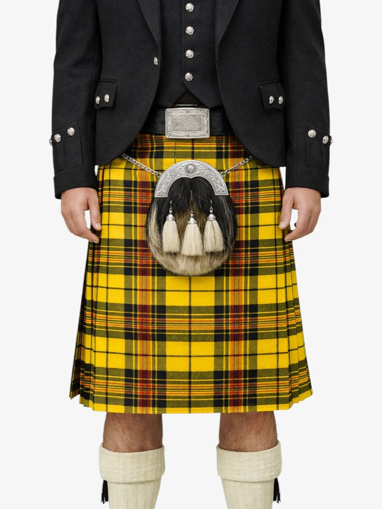 Person wearing a traditional Scottish kilt with a sporran on a white background