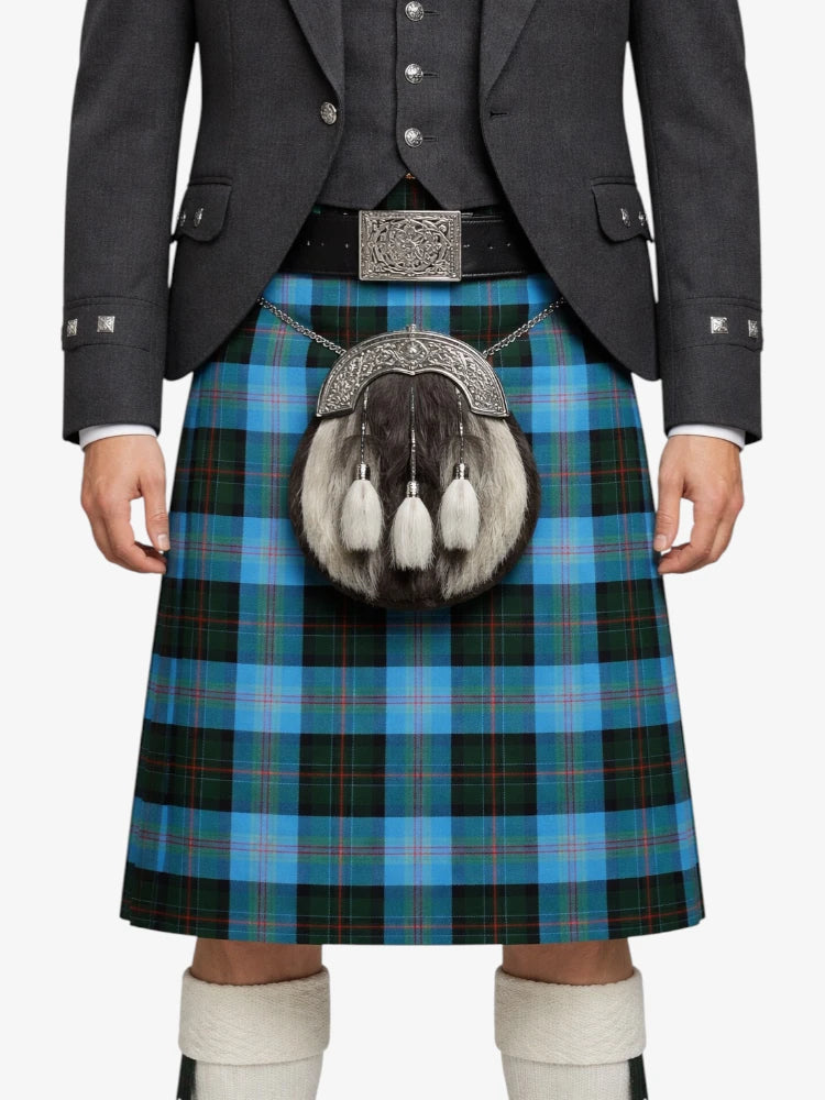 Person wearing a Scottish kilt with a tartan pattern on a white background