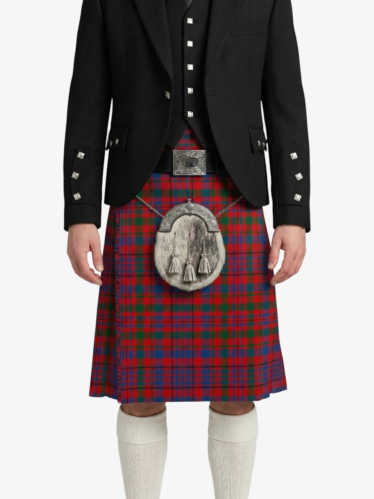 Person wearing a red tartan kilt with a black jacket on a white background