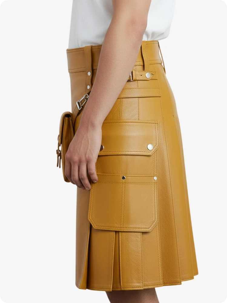 Tan leather skirt with multiple pockets and zippers on a white background