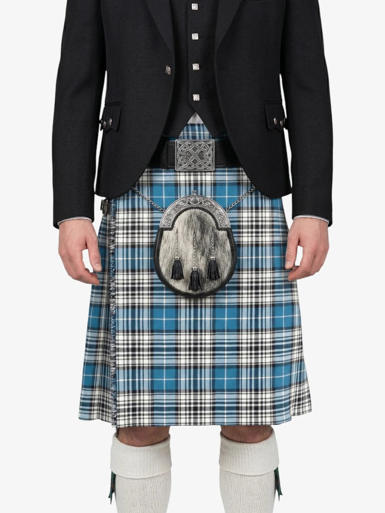 Person wearing a black jacket and blue plaid kilt on a white background
