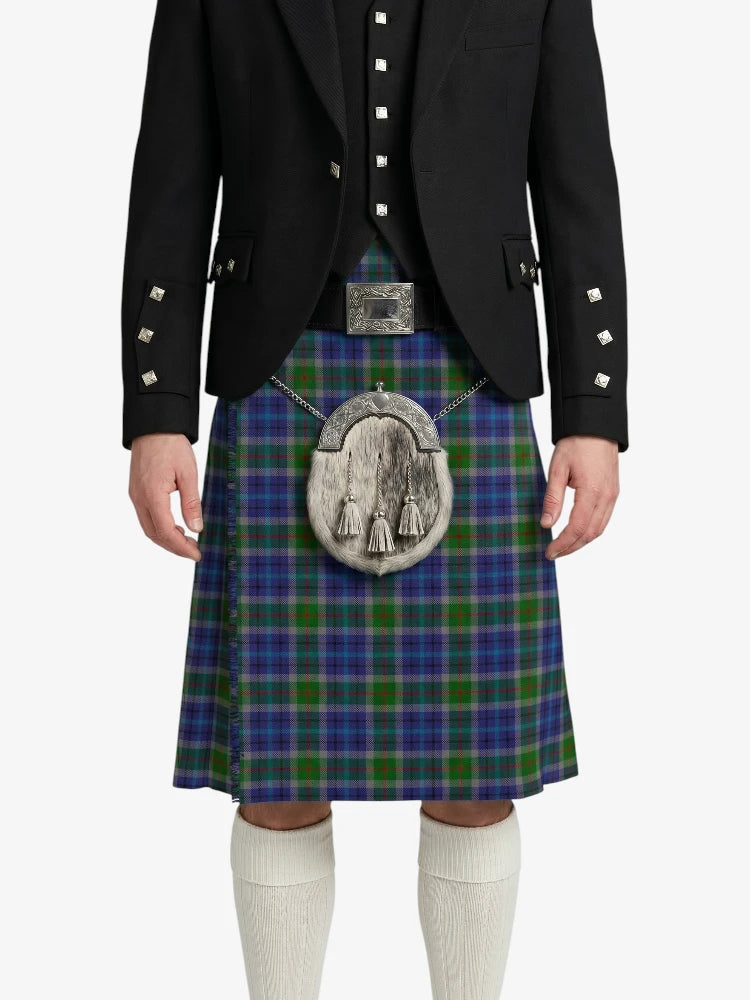 Person wearing a traditional Scottish kilt with a jacket on a white background