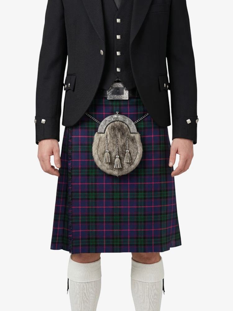 Person wearing a Scottish kilt with a jacket on a white background