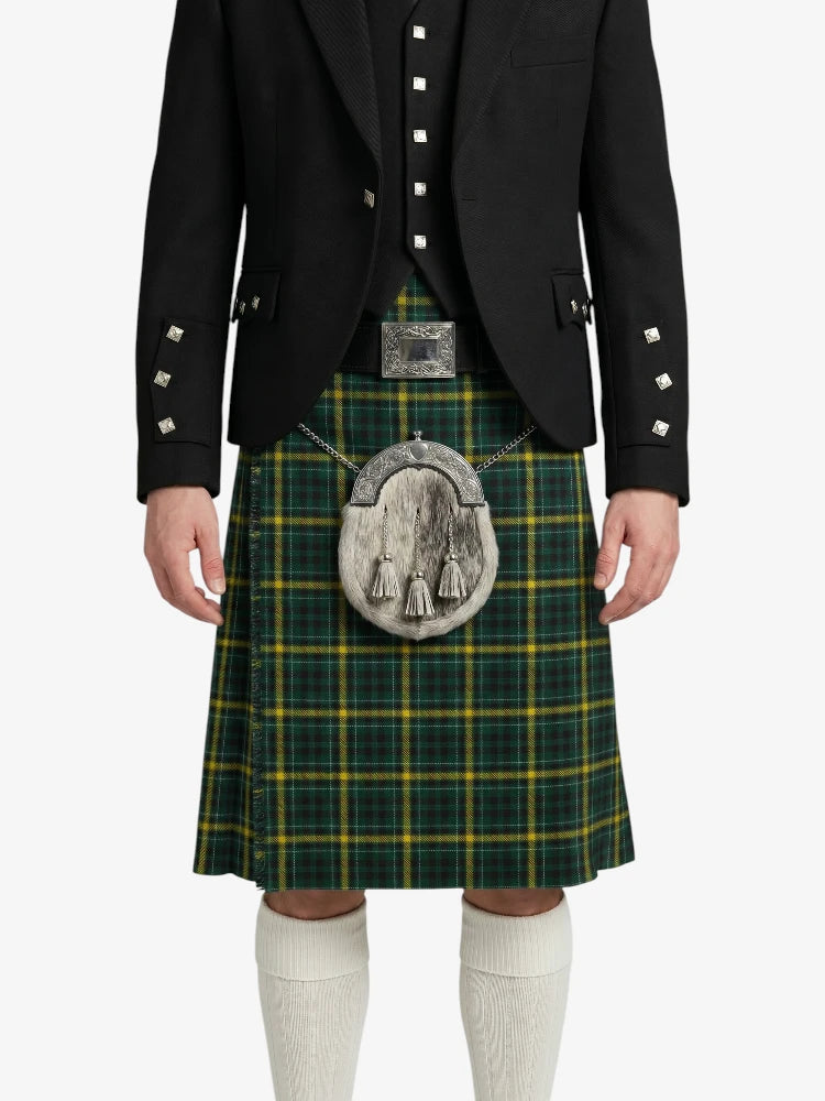 Person wearing a green plaid kilt with a black jacket on a white background