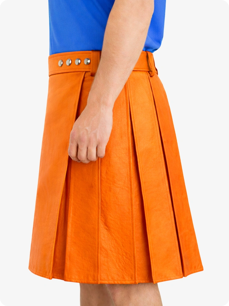 Orange pleated skirt worn by a person on a white background
