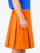 Orange pleated skirt worn with a blue top on a white background