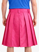 Person wearing a blue top and pink pleated skirt on a white background