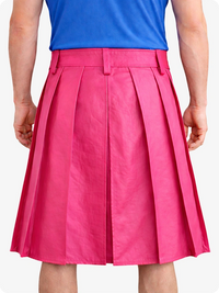 Person wearing a blue top and pink pleated skirt on a white background