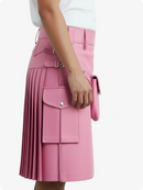 Pink pleated skirt with cargo pockets and a white top on a light gray background