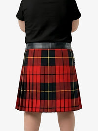 Person wearing a red and black plaid skirt with a plain background