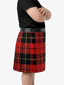 Person wearing a red and black plaid skirt with a plain background