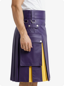 Purple kilt with yellow accent worn by a person on a white background
