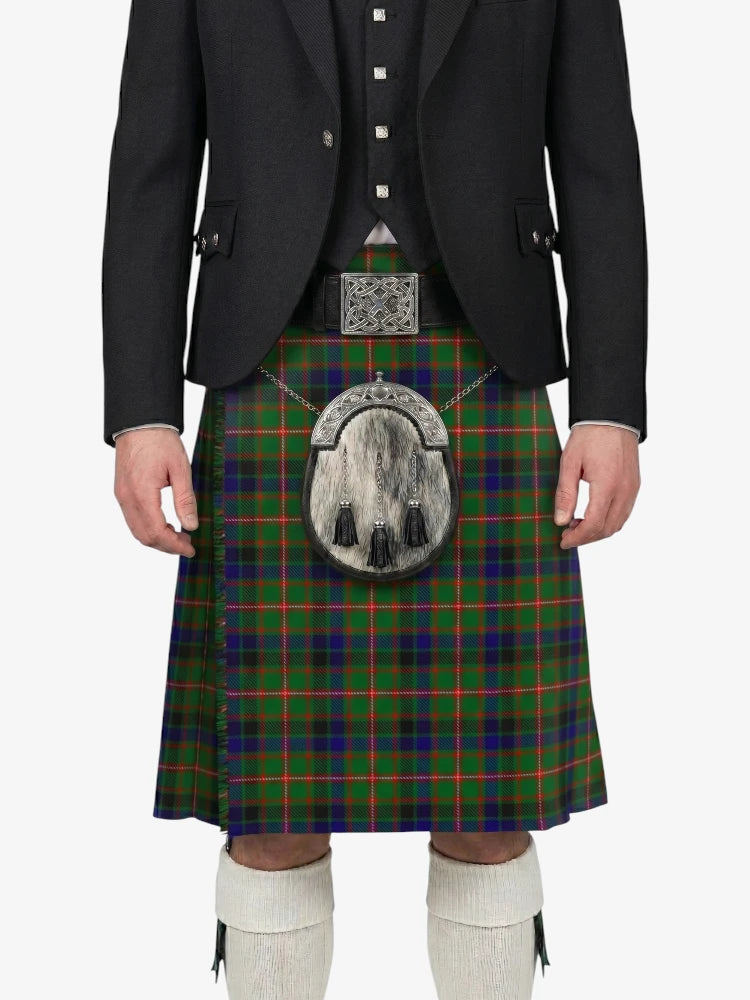 Person wearing a traditional Scottish kilt with a tartan pattern on a white background