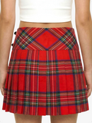 Red plaid skirt worn by a person on a white background