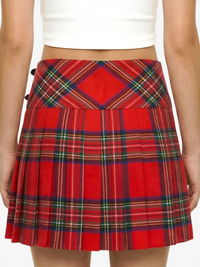 Red plaid skirt worn by a person on a white background
